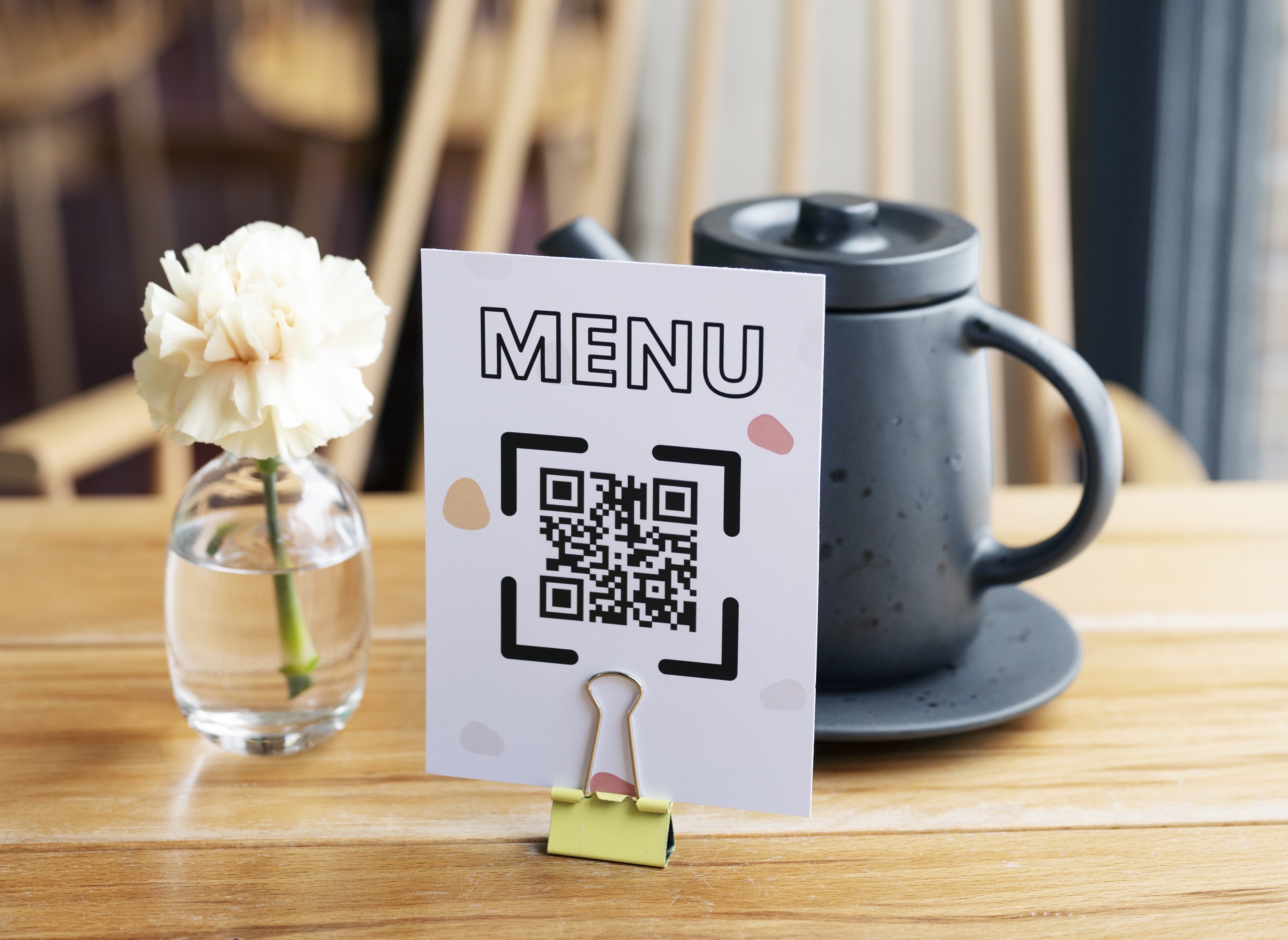 Customers using QR code menu in restaurant